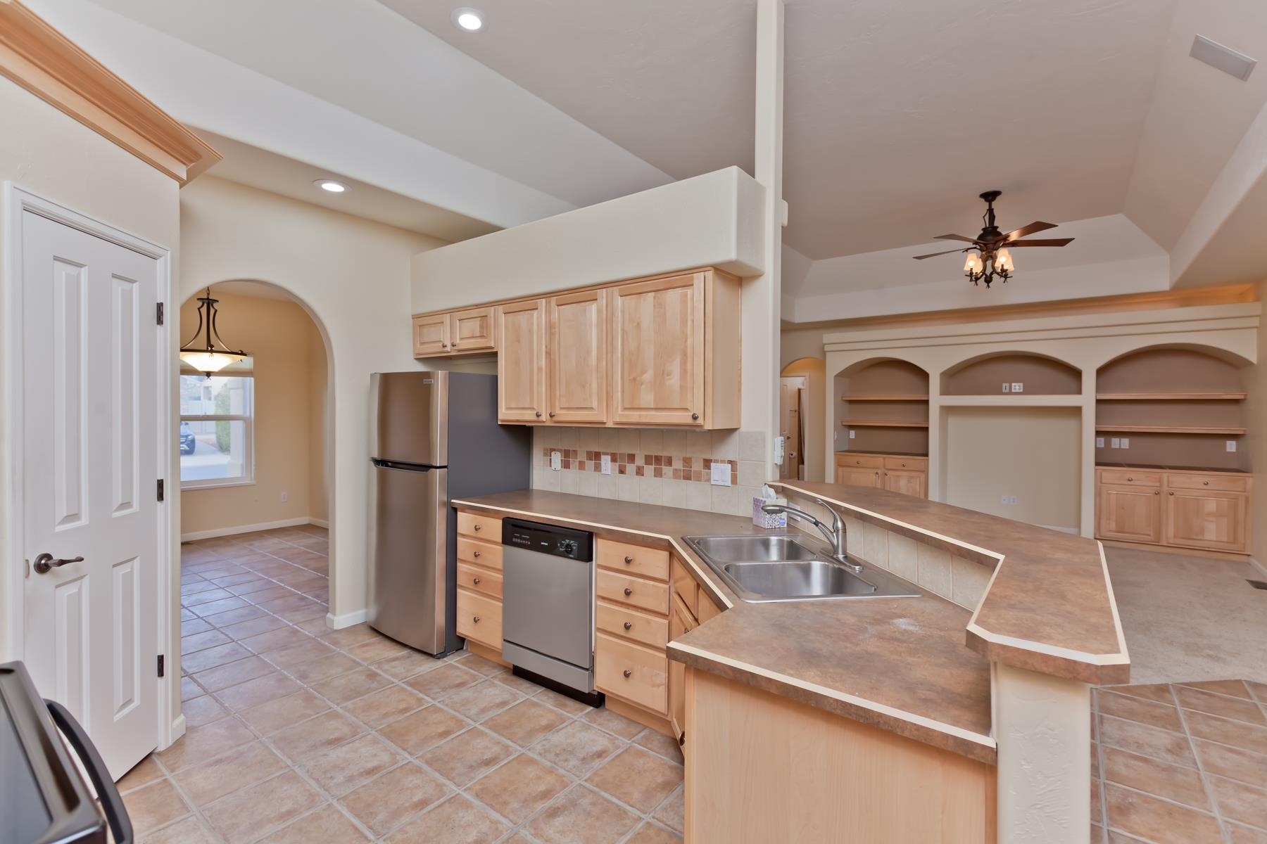 2433 Jack Creek Road Grand Junction, CO 81505 - Photo 3 of 41 a kitchen with stainless steel appliances granite countertop a sink and cabinets