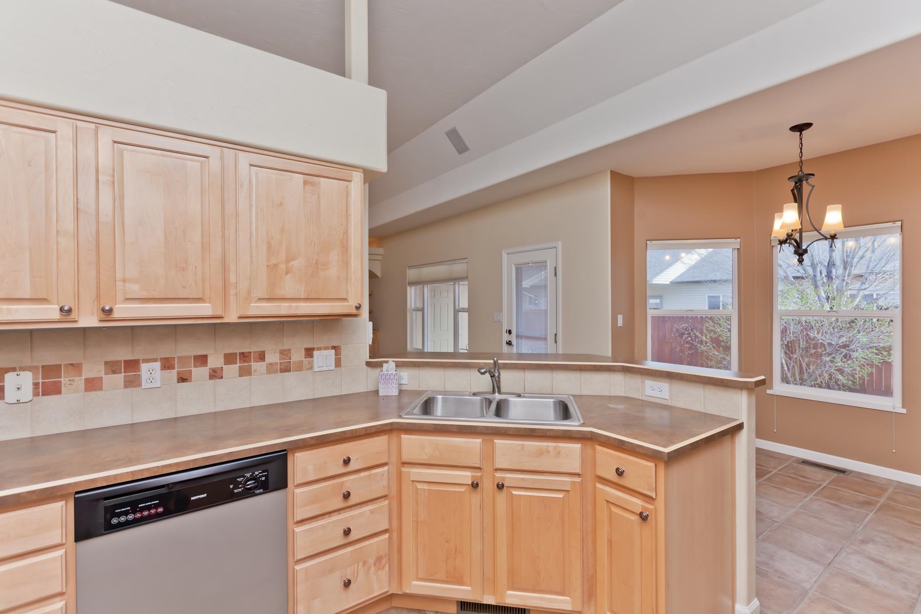 2433 Jack Creek Road Grand Junction, CO 81505 - Photo 4 of 41 a kitchen with granite countertop white cabinets and a sink