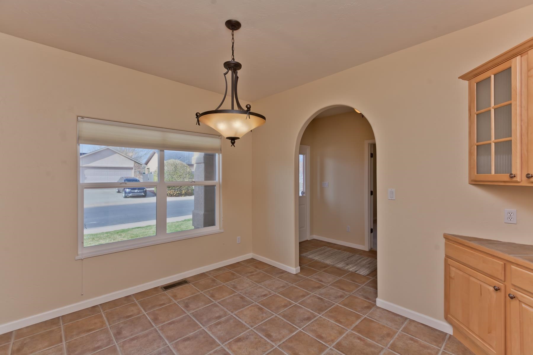 2433 Jack Creek Road Grand Junction, CO 81505 - Photo 8 of 41 a view of empty room with windows and chandelier