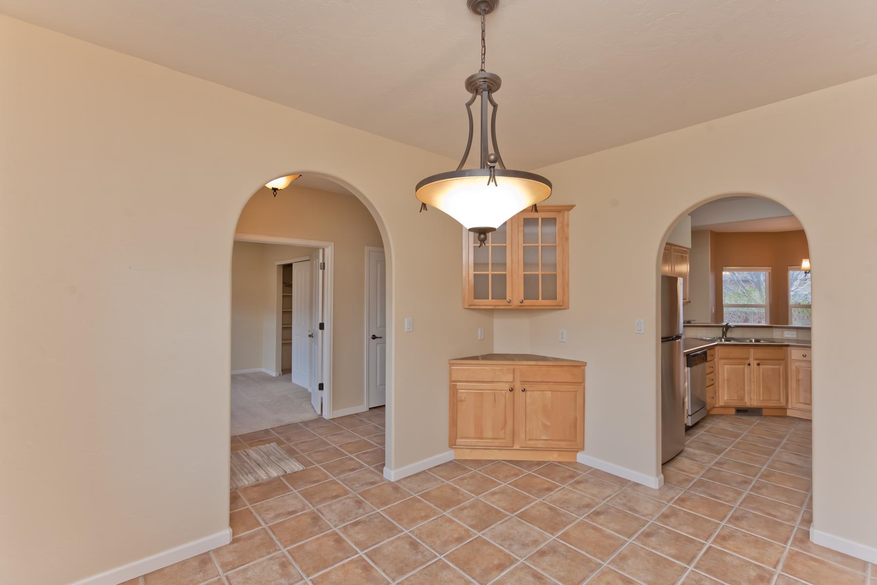 2433 Jack Creek Road Grand Junction, CO 81505 - Photo 9 of 41 a view of a livingroom with chandelier and kitchen view