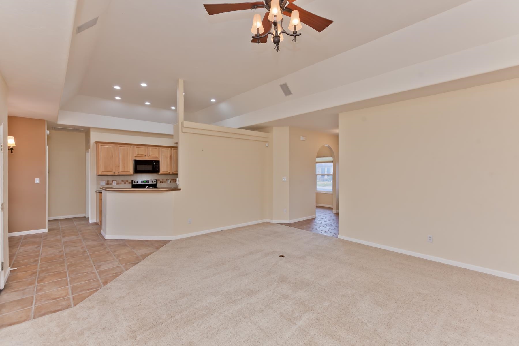 2433 Jack Creek Road Grand Junction, CO 81505 - Photo 10 of 41 an empty room with a empty space and a ceiling fan