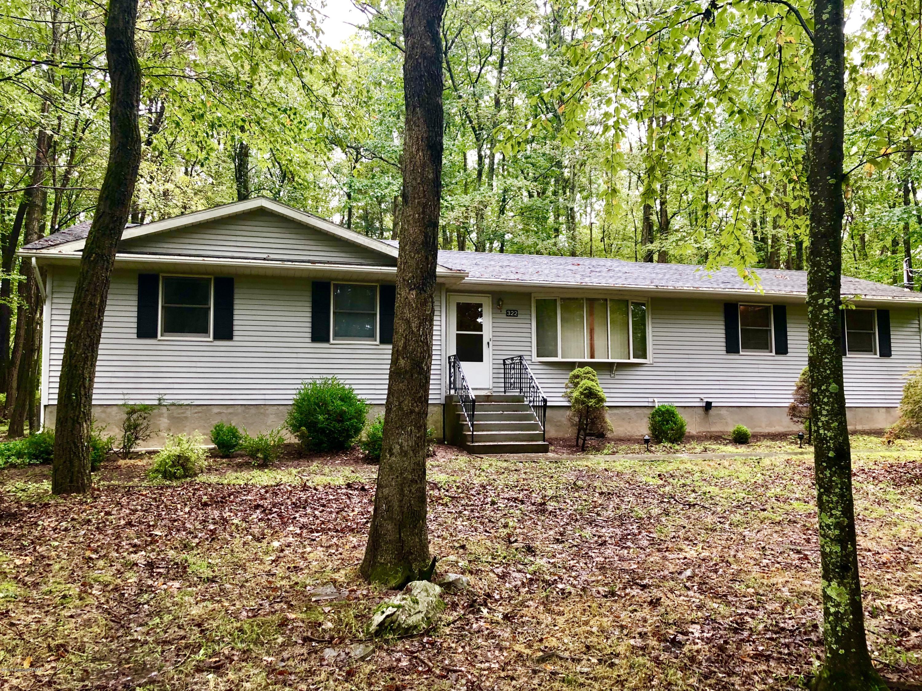 322 Charles Folly Road Bartonsville, PA 18321 - Photo 1 of 25 a front view of a house with garden