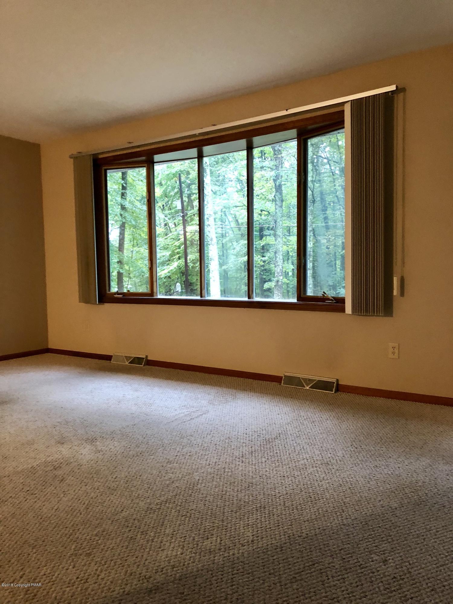 322 Charles Folly Road Bartonsville, PA 18321 - Photo 11 of 25 an empty room with a window