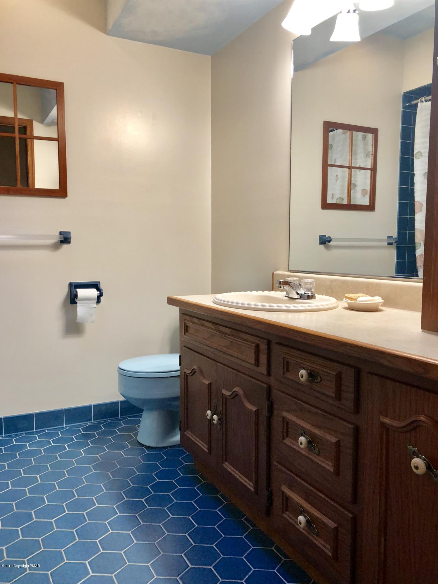 322 Charles Folly Road Bartonsville, PA 18321 - Photo 14 of 25 a bathroom with a sink and a toilet