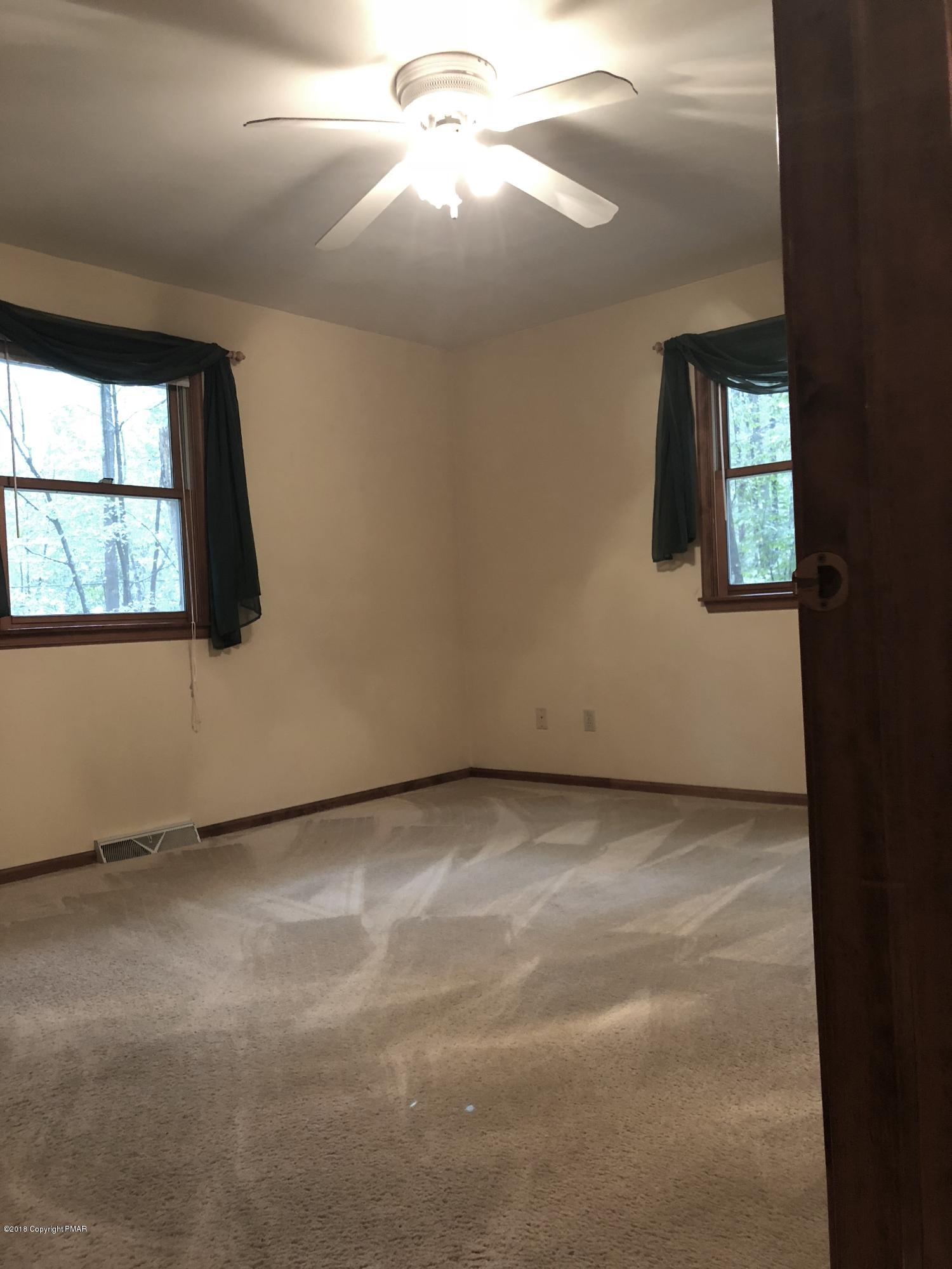 322 Charles Folly Road Bartonsville, PA 18321 - Photo 15 of 25 an empty room with windows and entrance