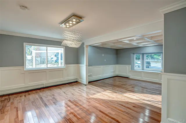 a view of a livingroom with an empty space and a fireplace