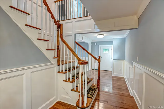 a large kitchen with stainless steel appliances granite countertop a stove and a refrigerator