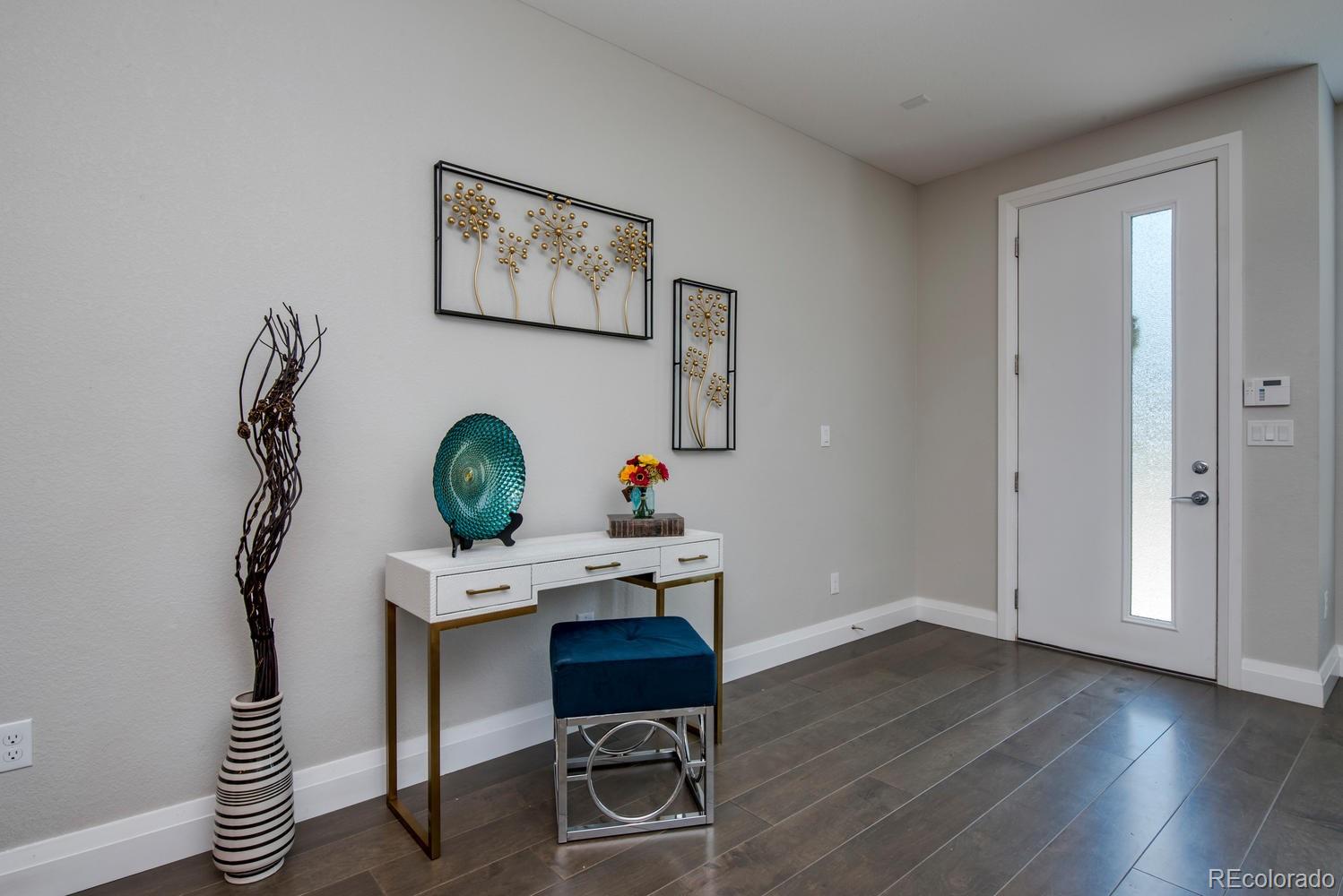 1571 Wolff Street Denver, CO 80204 - Photo 12 of 27 a workspace with furniture and wooden floor