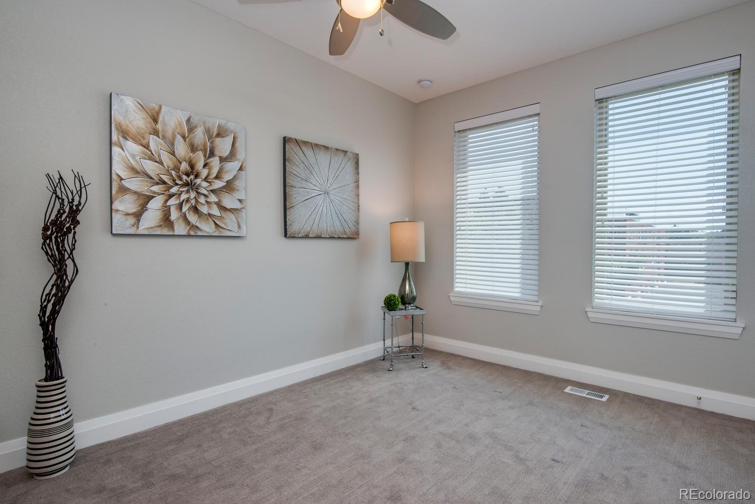 1571 Wolff Street Denver, CO 80204 - Photo 14 of 27 a view of an empty room with a window and a fan