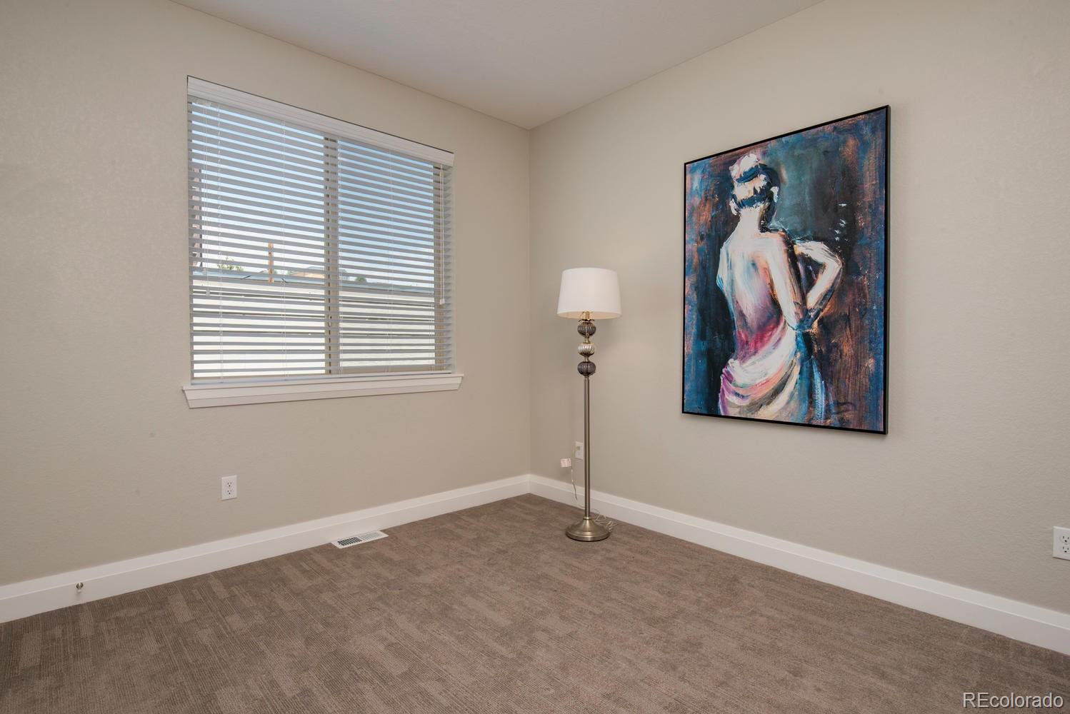 1571 Wolff Street Denver, CO 80204 - Photo 18 of 27 a view of a room that has a painting on the wall