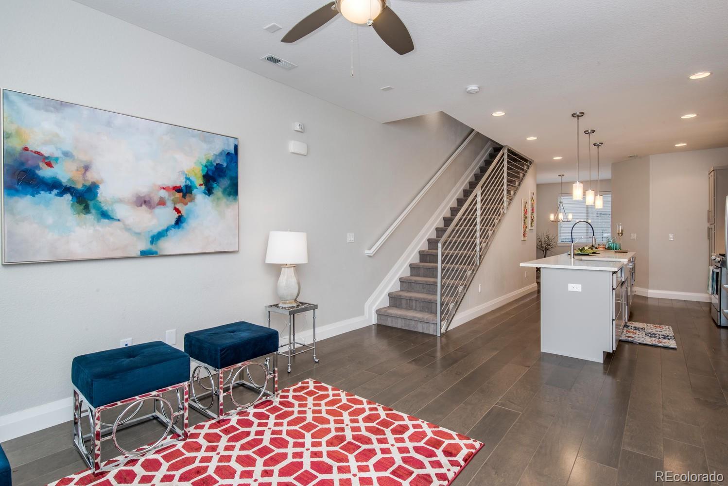 1571 Wolff Street Denver, CO 80204 - Photo 2 of 27 a living room with furniture and a rug