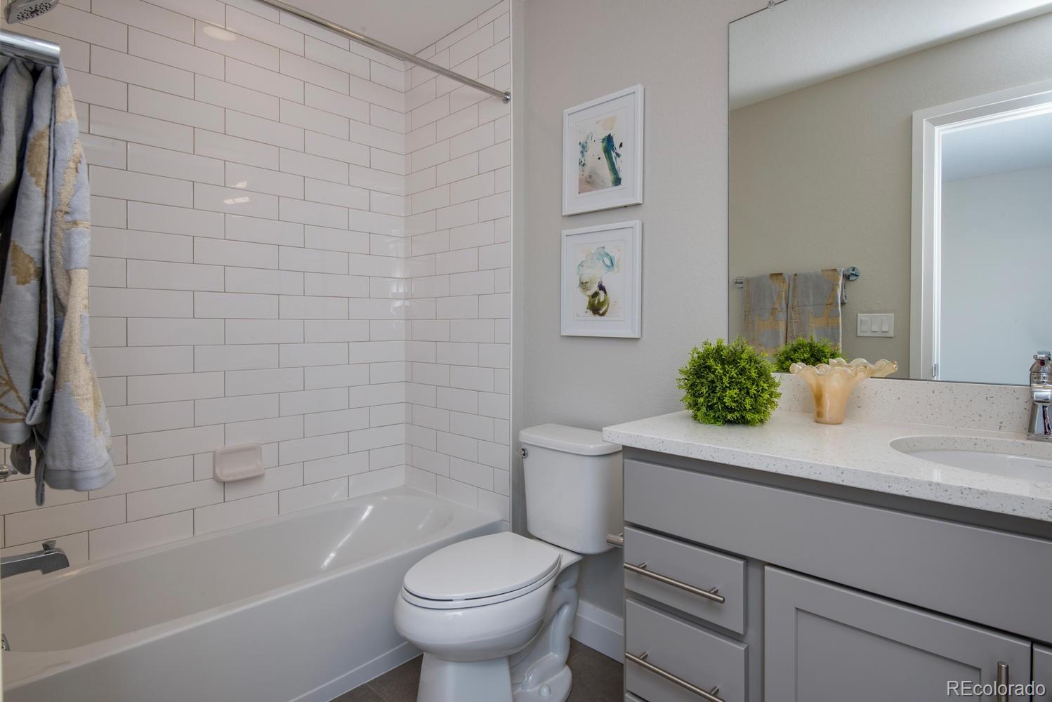 1571 Wolff Street Denver, CO 80204 - Photo 22 of 27 a bathroom with a sink toilet and shower
