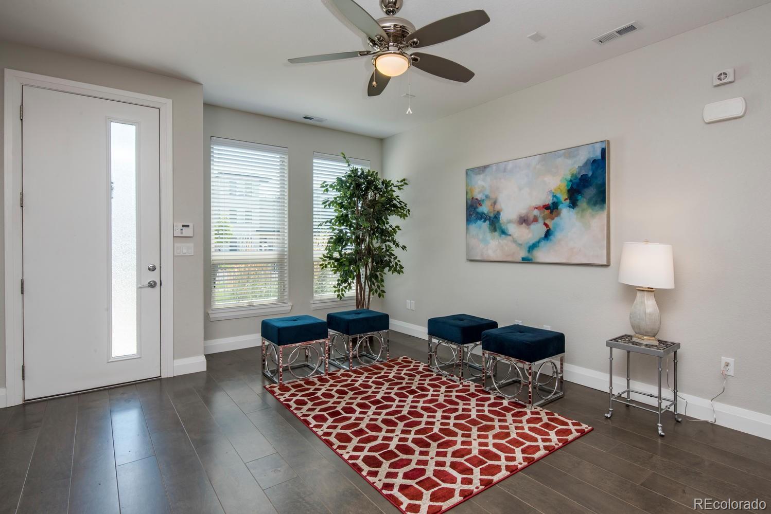 1571 Wolff Street Denver, CO 80204 - Photo 3 of 27 a living room with furniture and wooden floor