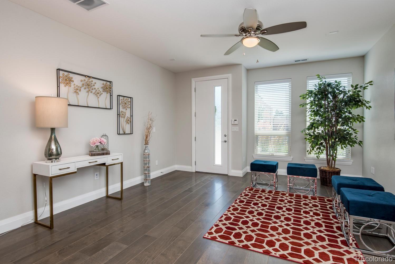1571 Wolff Street Denver, CO 80204 - Photo 4 of 27 a bedroom with furniture and a window