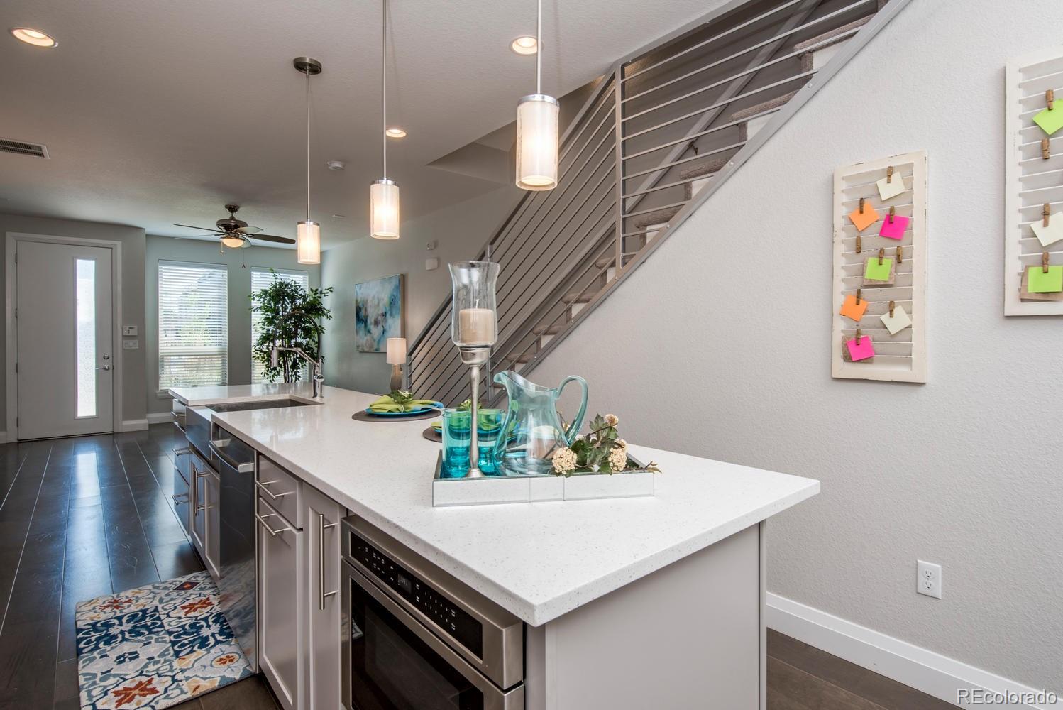 1571 Wolff Street Denver, CO 80204 - Photo 8 of 27 a view of entryway and kitchen