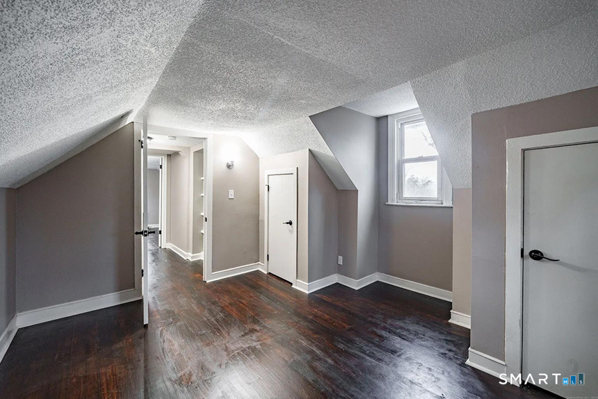 73 Silver Street Middletown, CT 06457 - Photo 25 of 30 an empty room with wooden floor and a window