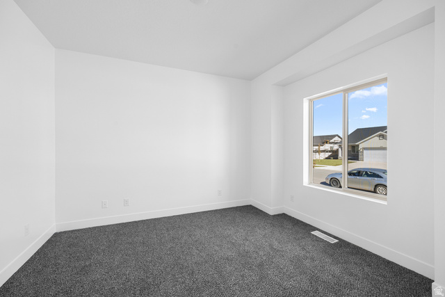 291 North Slant Road, Unit 46M Mapleton, UT 84660 - Photo 7 of 19 Unfurnished room featuring dark carpet and baseboards