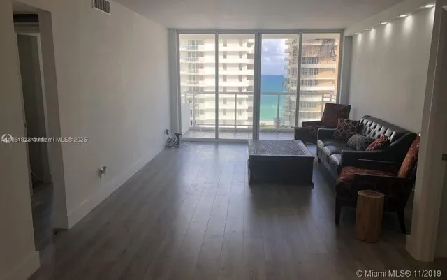 a bathroom with a sink toilet and mirror