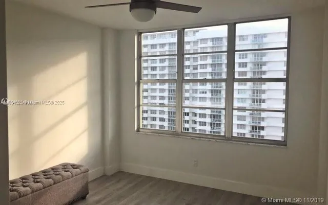 a bathroom with a double vanity sink toilet and a mirror