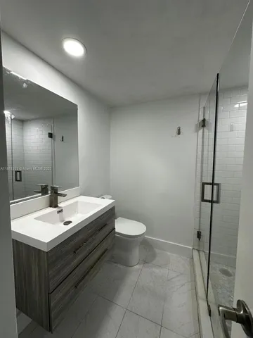 a view of a living room and kitchen