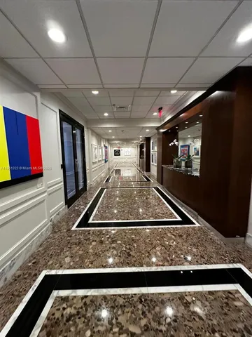 a view of a chairs and tables in a patio