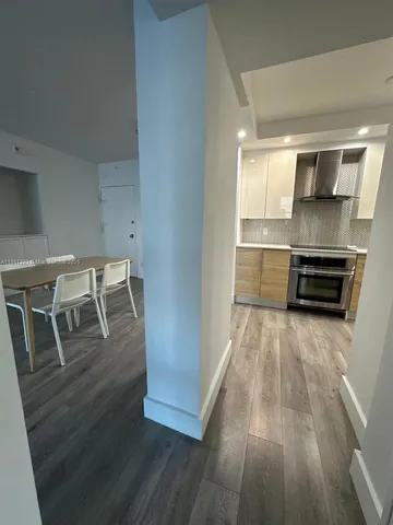 a bedroom with a bed and a lamp