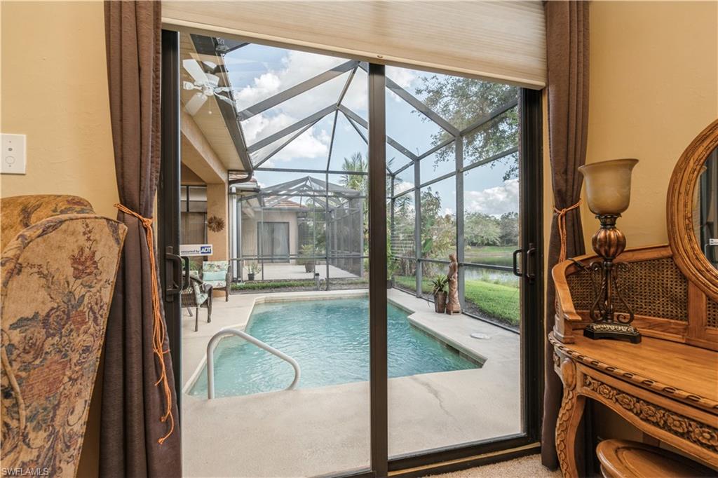 1411 Serrano Circle Naples, FL 34105 - Photo 29 of 50 View of swimming pool featuring a water view