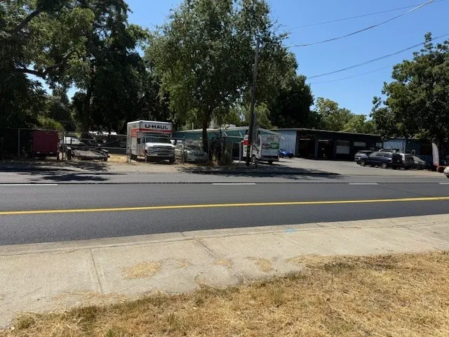 a view of a yard with trees