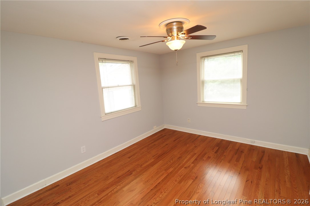 1000 Nichols Drive Raleigh, NC 27605 - Photo 17 of 22 wooden floor in an empty room with a window
