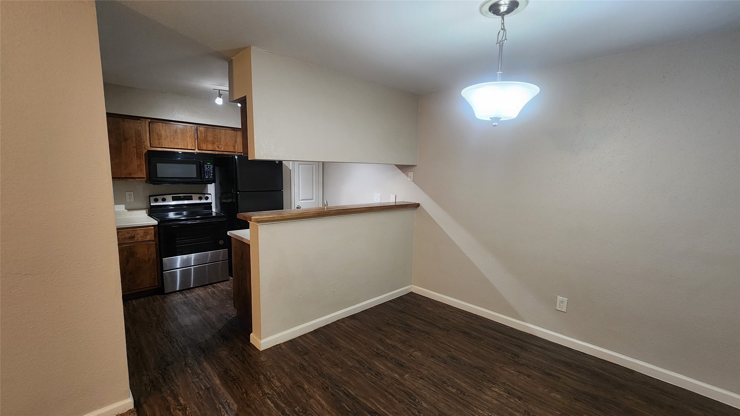 16303 Lyons School Road, Unit 701 Spring, TX 77379 - Photo 2 of 9 a view of a kitchen with a sink wooden floor and a window