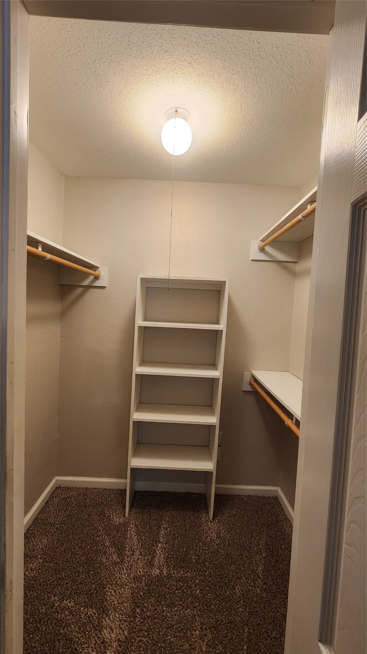 16303 Lyons School Road, Unit 701 Spring, TX 77379 - Photo 7 of 9 a view of walk in closet with empty racks