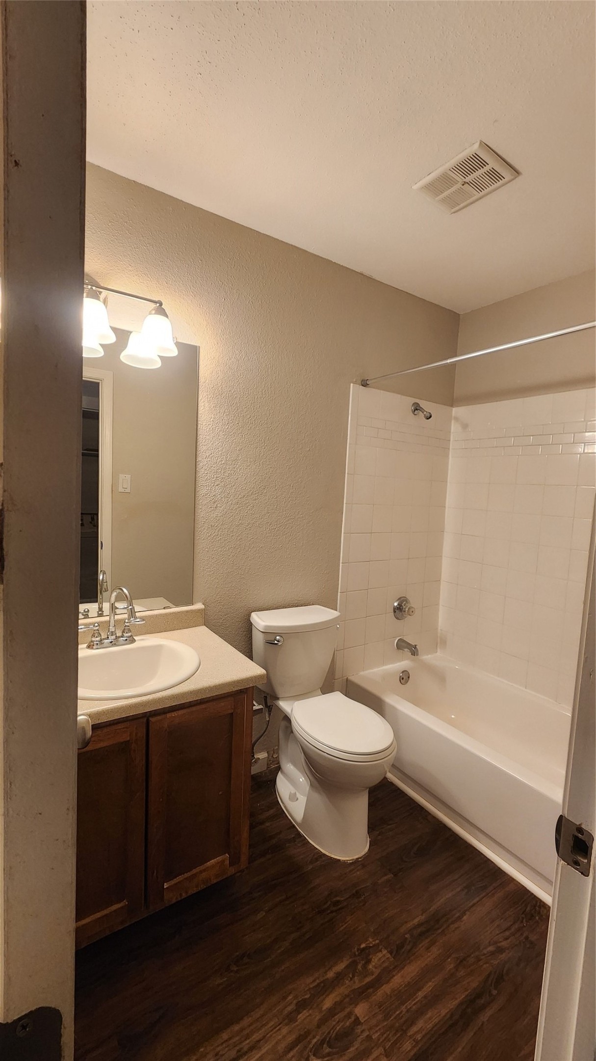 16303 Lyons School Road, Unit 701 Spring, TX 77379 - Photo 9 of 9 a bathroom with a sink toilet a mirror and shower