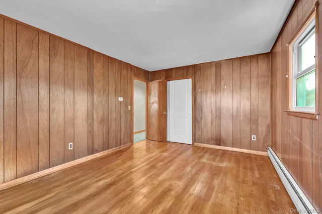 a view of house with backyard