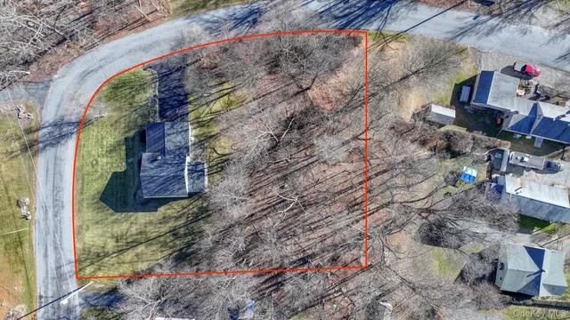 an aerial view of house with yard swimming pool and outdoor seating