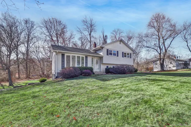 a house view with a sitting space and garden view
