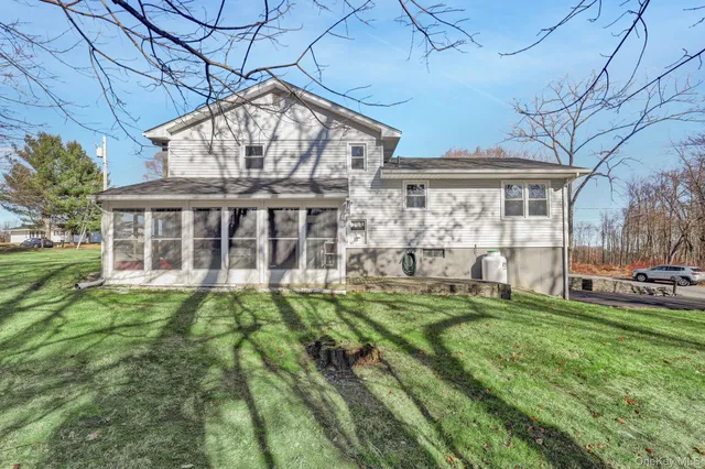 a backyard of a house with lots of green space