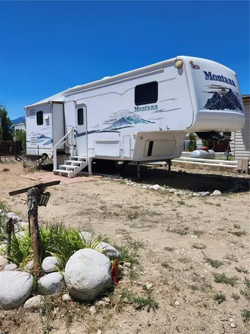 a view of a backyard of the house