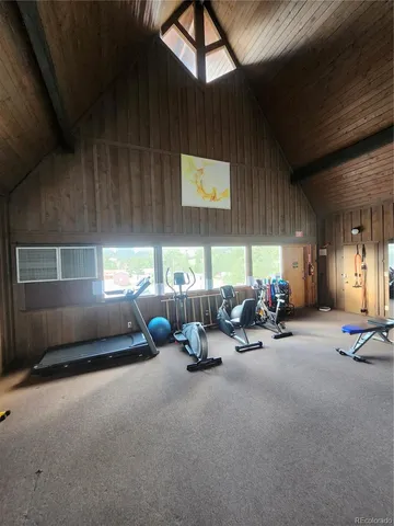 a view of a gym with pool table