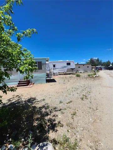 a view of a parking space and a yard