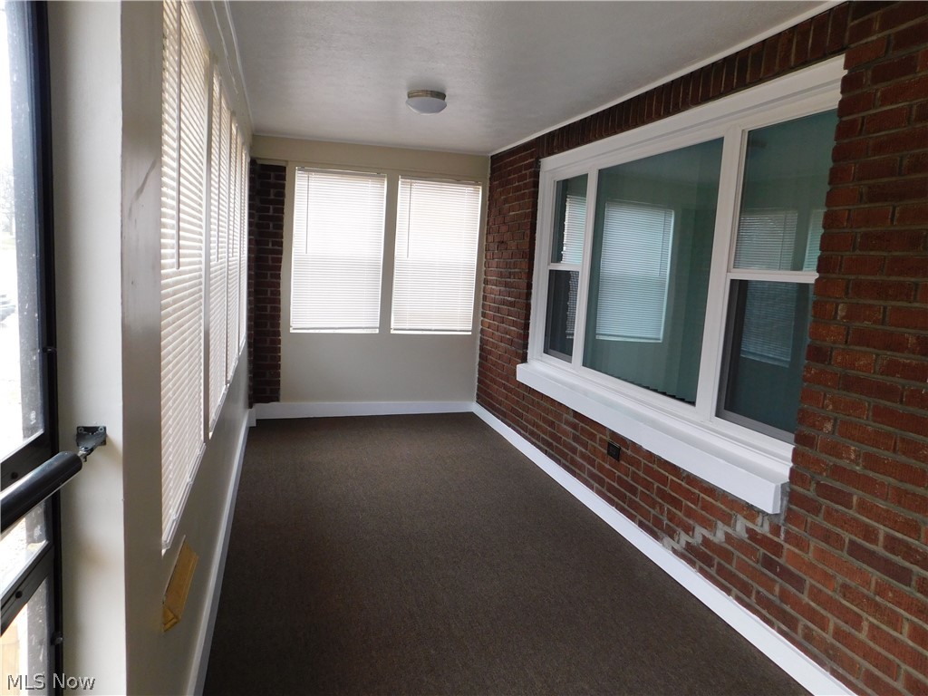 1227 Copley Road Akron, OH 44320 - Photo 17 of 35 Front porch has all new windows, new blinds new security front door and new steel front door