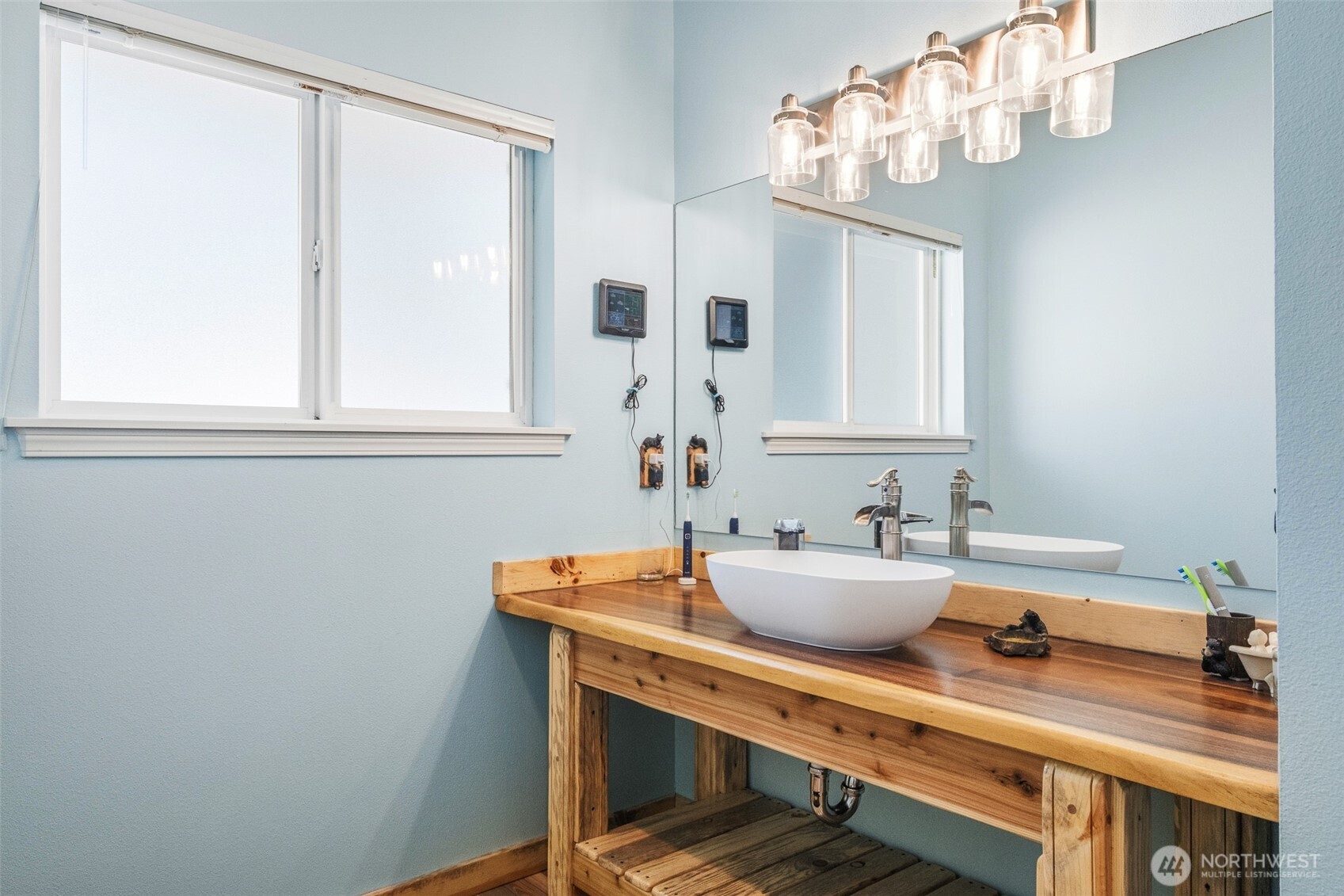8348 Main Street, Unit 1 Peshastin, WA 98847 - Photo 30 of 40 a bathroom with a sink and a mirror