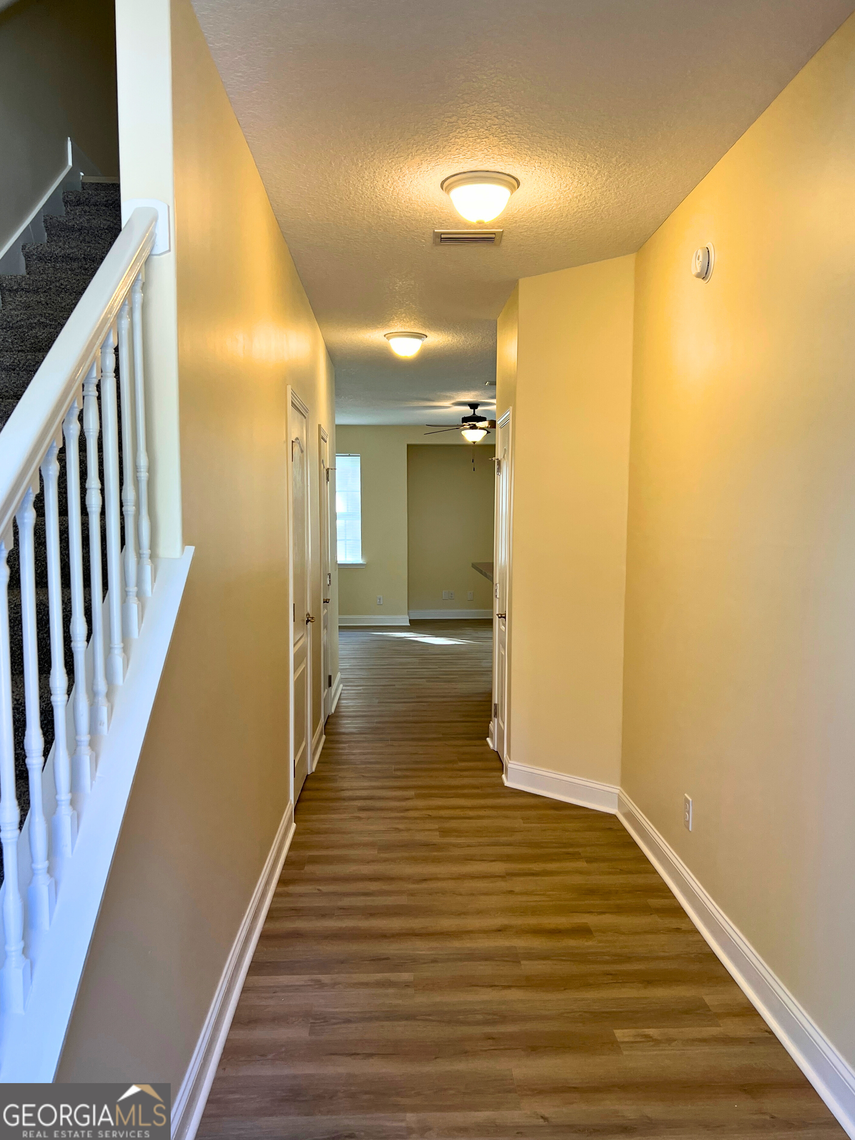 818 Davis Avenue Kingsland, GA 31548 - Photo 2 of 29 a view of a hallway with wooden floor