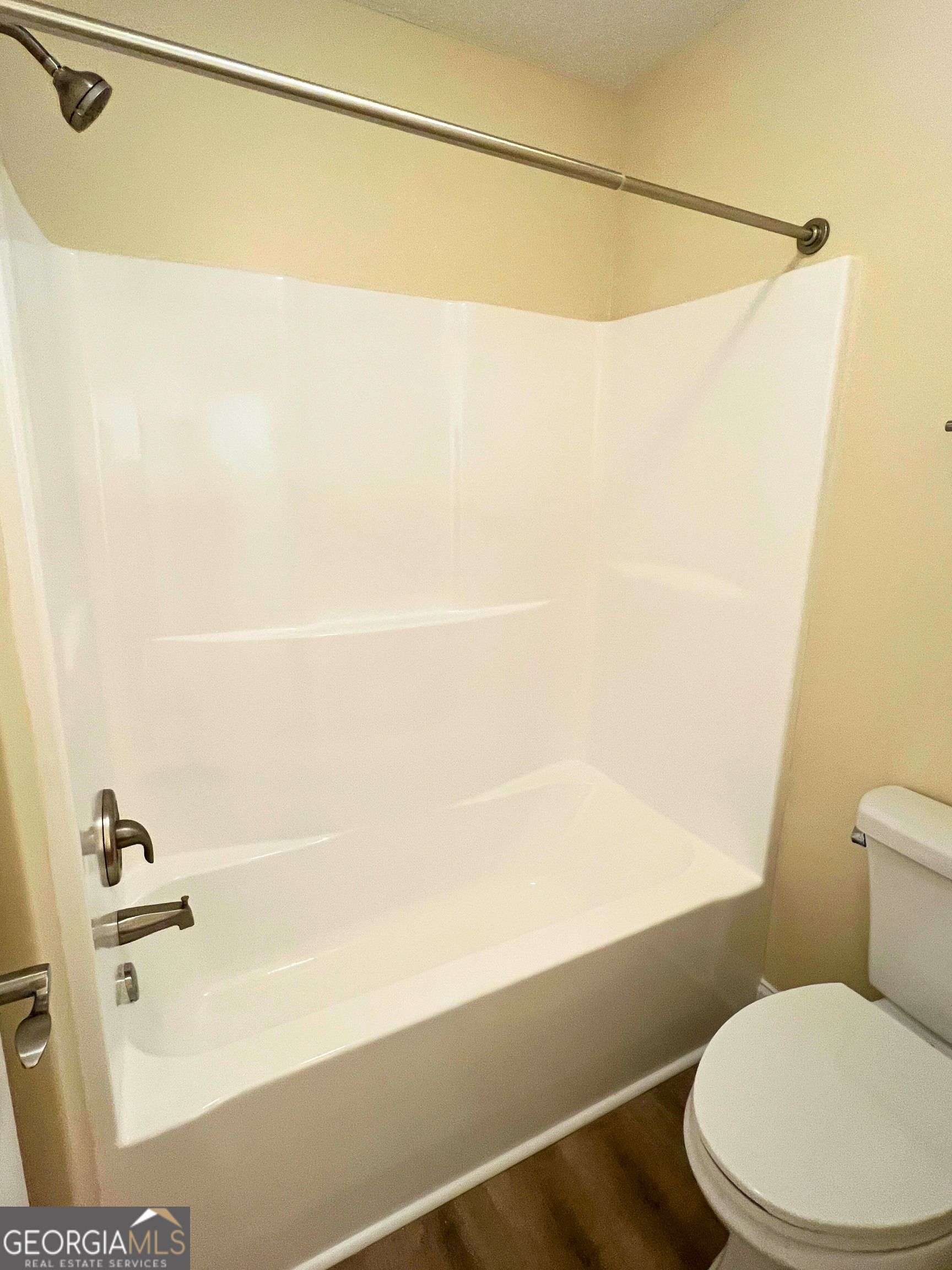 818 Davis Avenue Kingsland, GA 31548 - Photo 21 of 29 a bathroom with a shower and a toilet