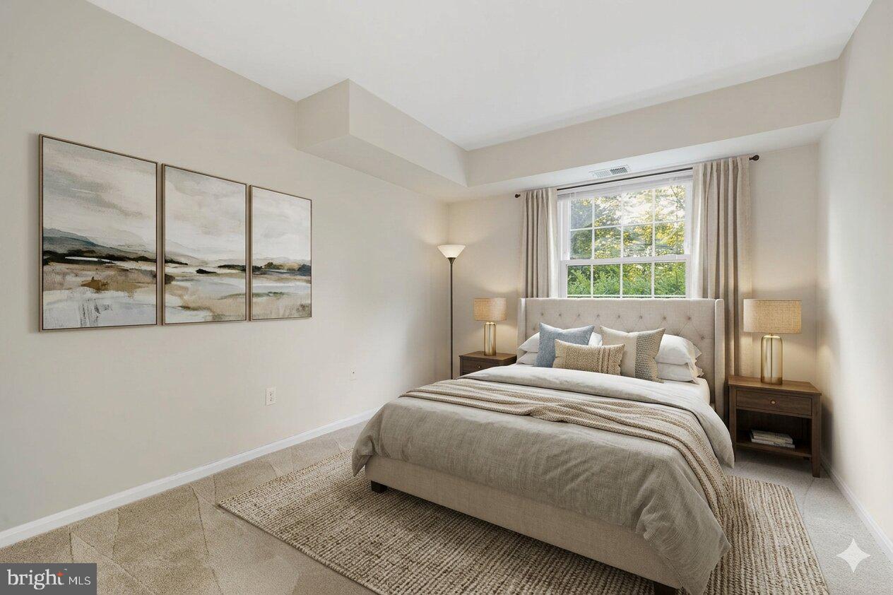 5817 Rexford Drive, Unit 798 Springfield, VA 22152 - Photo 9 of 23 a bedroom with a bed and a window