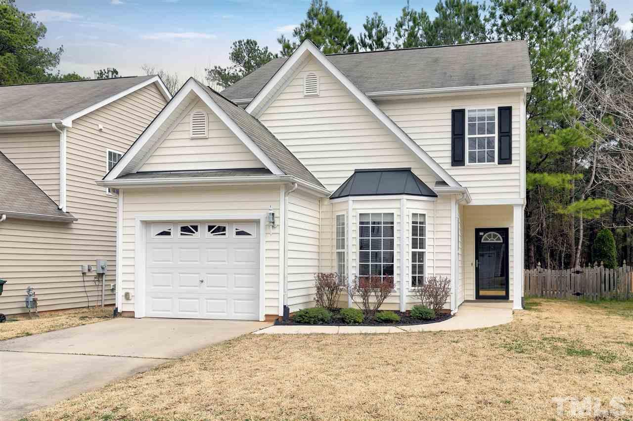 8424 Aztec Dawn Court Raleigh, NC 27613 - Photo 1 of 30 a view of house with a yard and garage