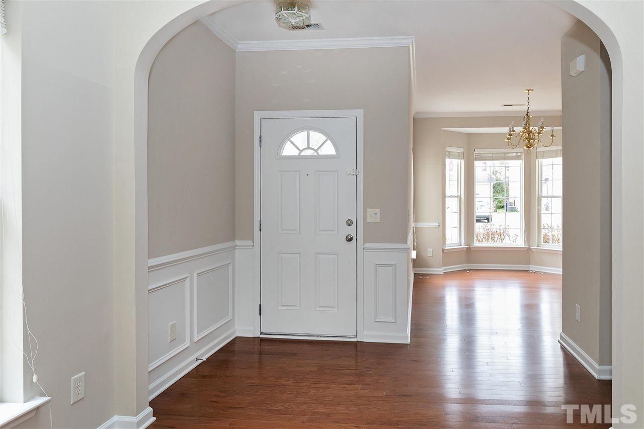 8424 Aztec Dawn Court Raleigh, NC 27613 - Photo 2 of 30 a view of empty room with wooden floor and fan