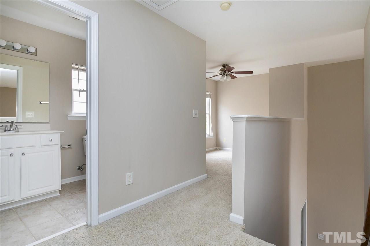 8424 Aztec Dawn Court Raleigh, NC 27613 - Photo 19 of 30 a bathroom with a double vanity sink toilet and shower