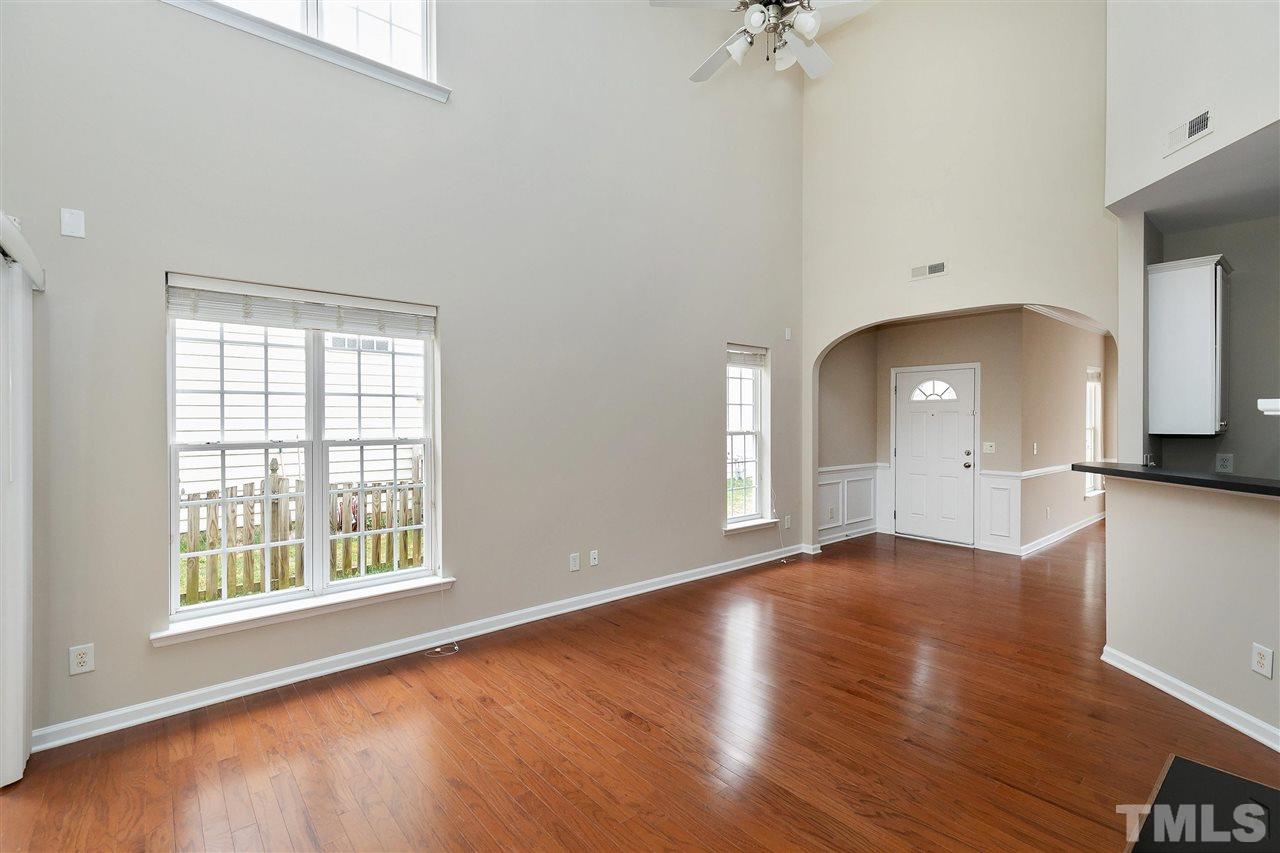 8424 Aztec Dawn Court Raleigh, NC 27613 - Photo 3 of 30 wooden floor in an empty room with a window