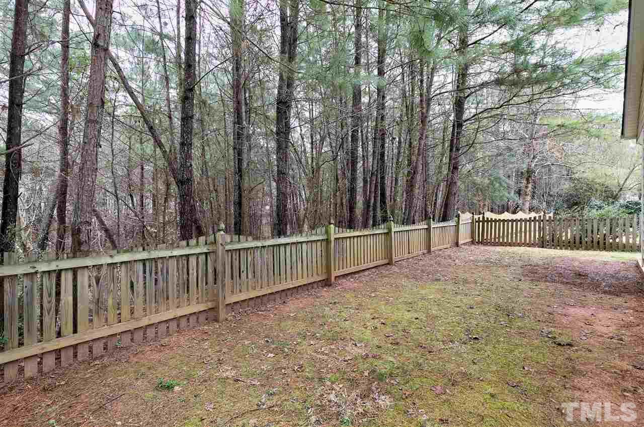 8424 Aztec Dawn Court Raleigh, NC 27613 - Photo 27 of 30 a view of backyard and tree