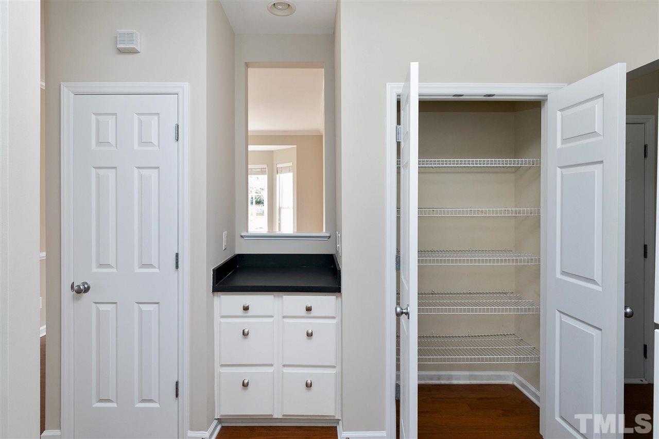 8424 Aztec Dawn Court Raleigh, NC 27613 - Photo 10 of 30 a view of an empty room with closet and mirror